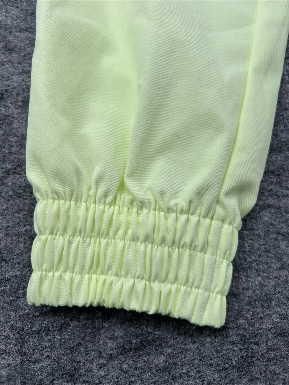 Nike Women's Sportswear Woven Pants in a bright neon green/yellow XS